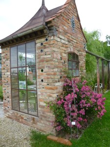 Small historic outbuilding, restored and placed on the grounds.